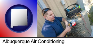 Albuquerque, New Mexico - an HVAC contractor servicing an air conditioner