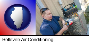 an HVAC contractor servicing an air conditioner in Belleville, IL