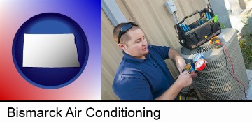 an HVAC contractor servicing an air conditioner in Bismarck, ND
