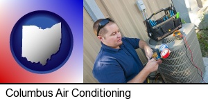 Columbus, Ohio - an HVAC contractor servicing an air conditioner