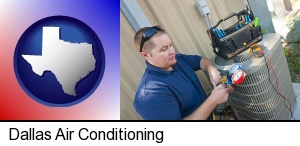 Dallas, Texas - an HVAC contractor servicing an air conditioner
