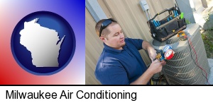 Milwaukee, Wisconsin - an HVAC contractor servicing an air conditioner