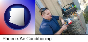 Phoenix, Arizona - an HVAC contractor servicing an air conditioner