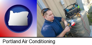 Portland, Oregon - an HVAC contractor servicing an air conditioner