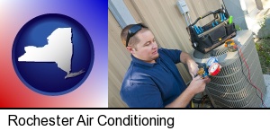 Rochester, New York - an HVAC contractor servicing an air conditioner
