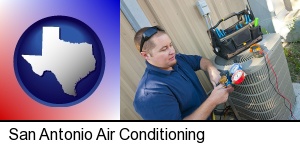 San Antonio, Texas - an HVAC contractor servicing an air conditioner