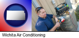 Wichita, Kansas - an HVAC contractor servicing an air conditioner