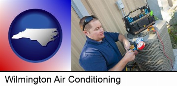 an HVAC contractor servicing an air conditioner in Wilmington, NC