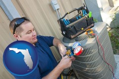 florida an HVAC contractor servicing an air conditioner