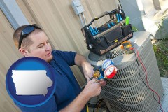 iowa an HVAC contractor servicing an air conditioner