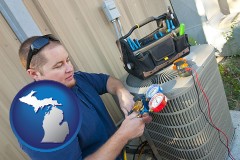 michigan an HVAC contractor servicing an air conditioner