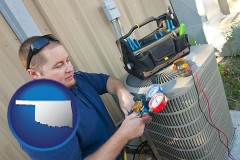 oklahoma an HVAC contractor servicing an air conditioner