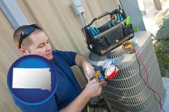 south-dakota an HVAC contractor servicing an air conditioner