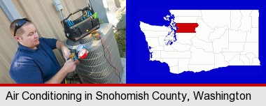 an HVAC contractor servicing an air conditioner; Snohomish County highlighted in red on a map