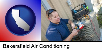 an HVAC contractor servicing an air conditioner in Bakersfield, CA