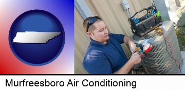 an HVAC contractor servicing an air conditioner in Murfreesboro, TN