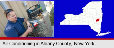 an HVAC contractor servicing an air conditioner; Albany County highlighted in red on a map