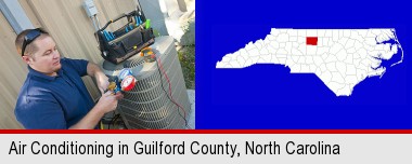 an HVAC contractor servicing an air conditioner; Guilford County highlighted in red on a map