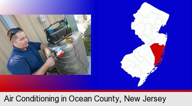 an HVAC contractor servicing an air conditioner; Ocean County highlighted in red on a map